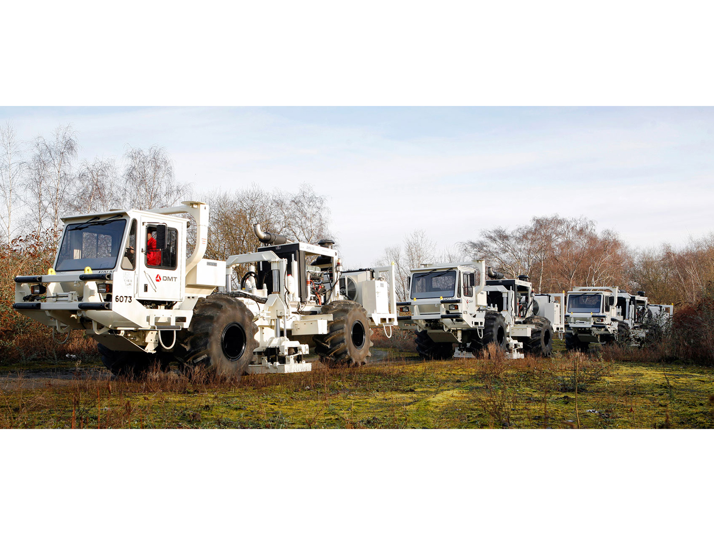 Vibroseis trucks for seismic data acquisition.